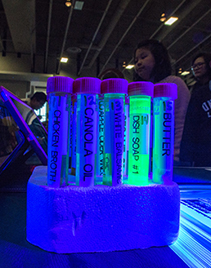 Test tubes viewed under a blacklight