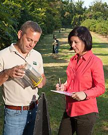 Two scientists with an insect trap