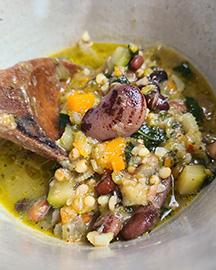 A bowl of bean and grain soup.