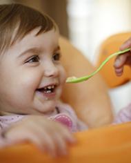 A baby being spoon fed