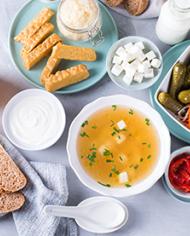 Foods containing probiotics including tempeh, kombucha, sauerkraut, pickles, kefir, yogurt, miso soup, soft cheese, sourdough bread