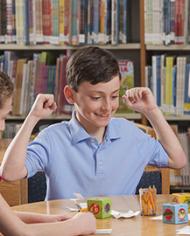 A boy participating in a nutrition education activity.