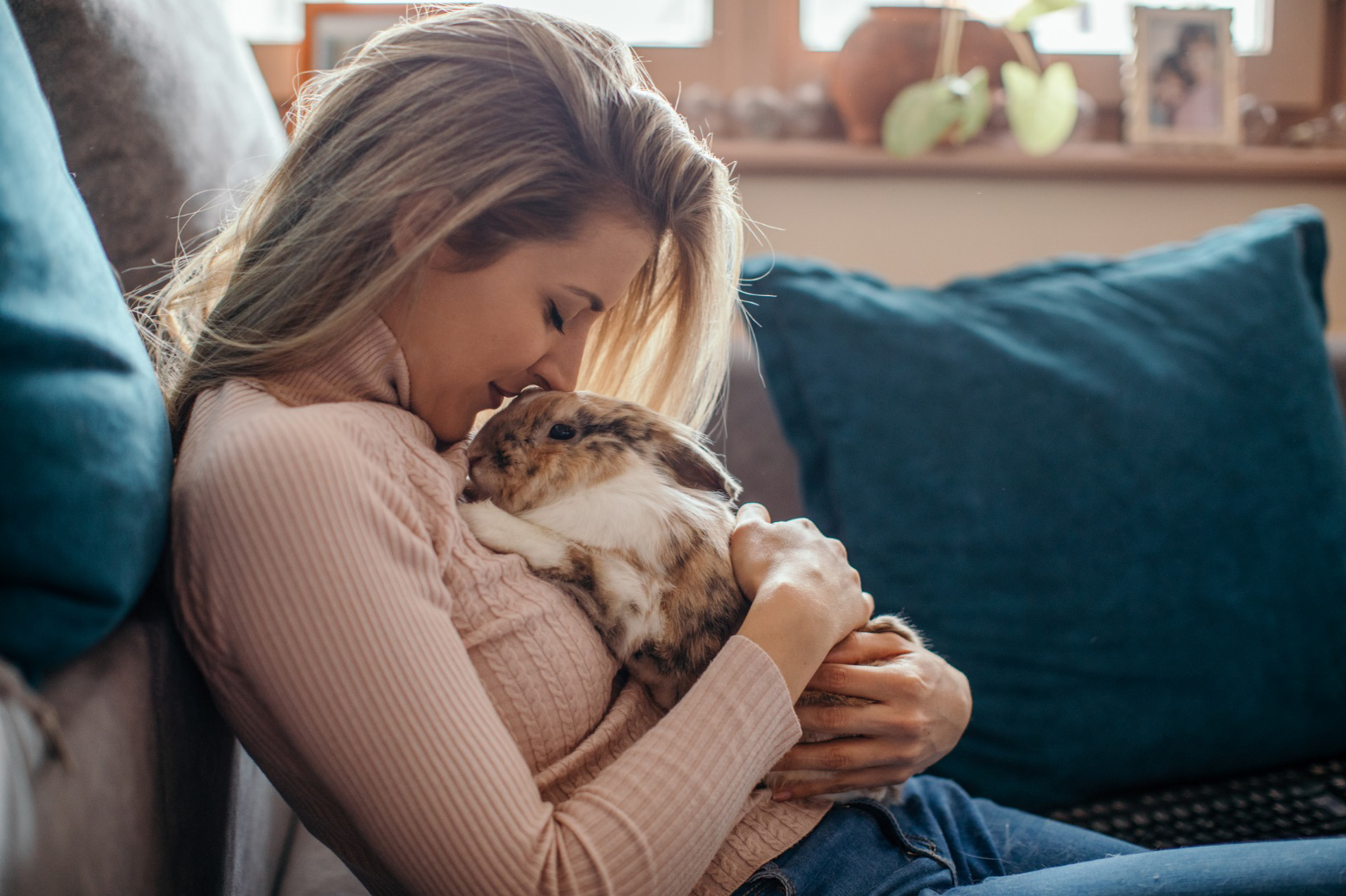 A woman holding a rabbit 