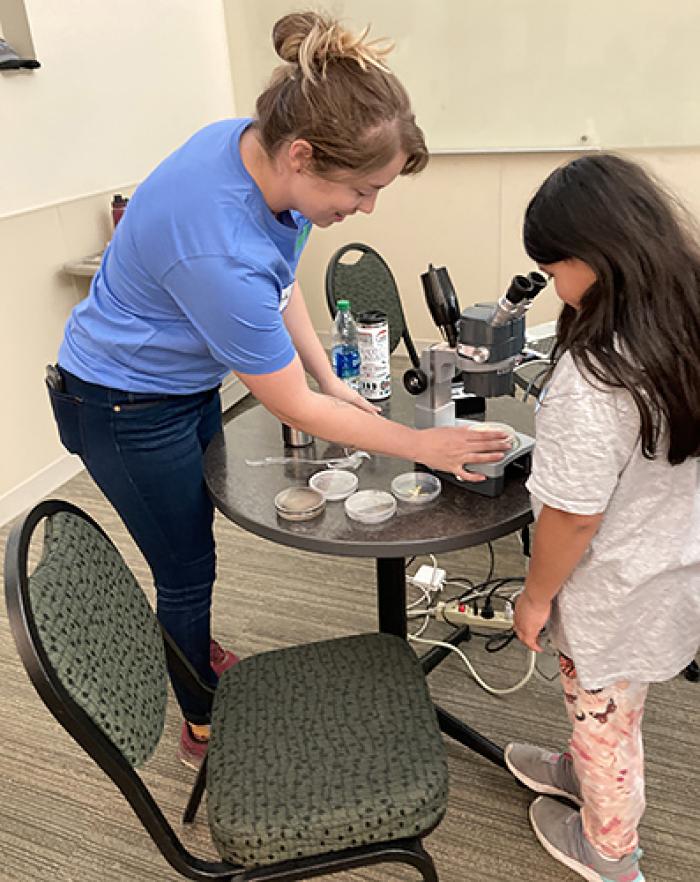 ARS scientist Olivia Todd talking to a student.