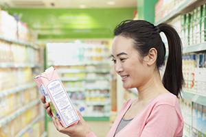 Nutritionlabels A young Asian woman reading a Nutrition Facts label