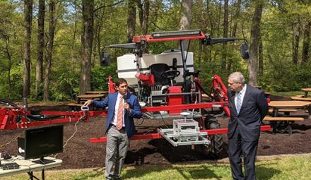 Smartcamera ARS research ecologist Steven Mirsky and USDA Secretary Tom Vilsack with a Deep Soil Core Rig tractor.